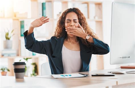 Premium Photo Tired Yawn And Business Woman At Desk In Office Feeling Exhausted Overworked And