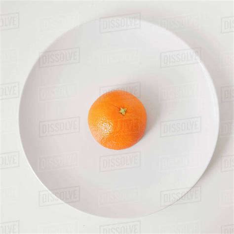 Orange On Plate Studio Shot Stock Photo Dissolve