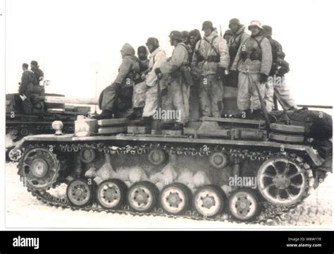 German Soldiers In White Winter Camouflage On Board A Panzer Lll On The