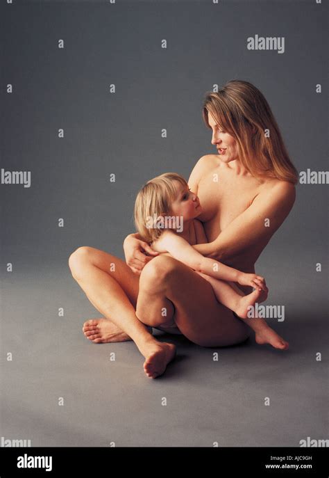 A Nude Mother Cradling Her Nude Infant Son Stock Photo Alamy