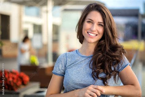 Big Bright White Smile Headshot With A Beautiful Brunette Woman Sincere