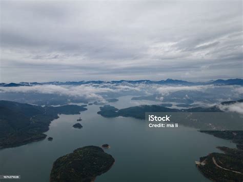 Aerial Photography Of Reservoirs In Urban Clouds And Mist Stock Photo