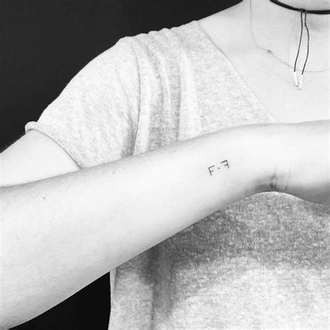 F.F initials tattooed on the wrist.