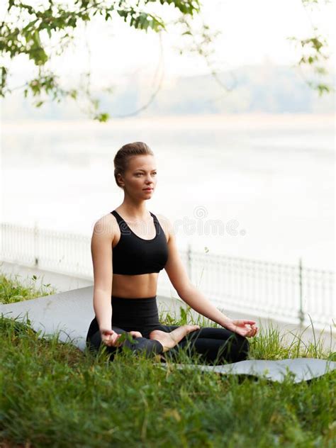 Young Pretty Woman Practicing Yoga Sitting In Lotus Pose Wearing In