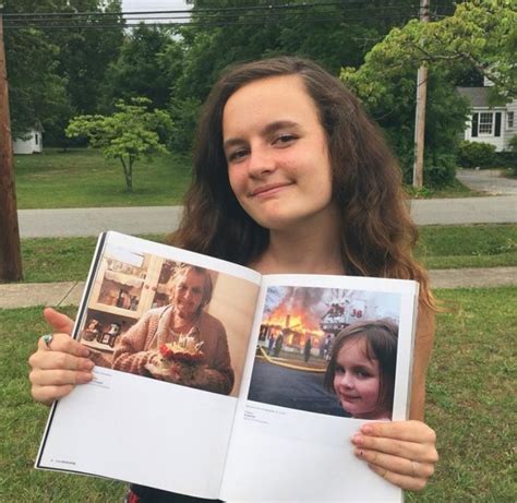 Disaster Girl Holding A Book With The Original Meme Photo Disaster