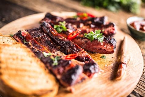 Tasty Barbecue Grilled Pork Ribs With Chili Pepers And Parsley H Stock