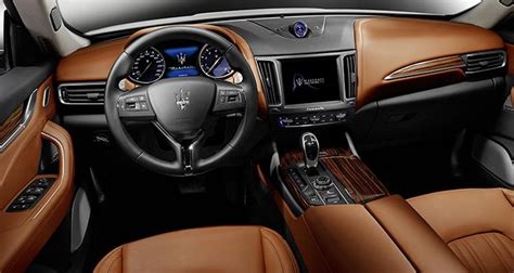 The Interior Of A Car With Brown Leather Trim