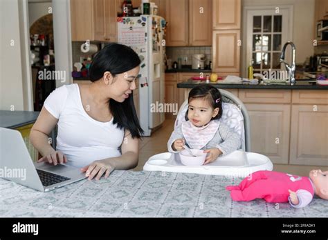 Asian Mother Baby Kitchen Hi Res Stock Photography And Images Alamy