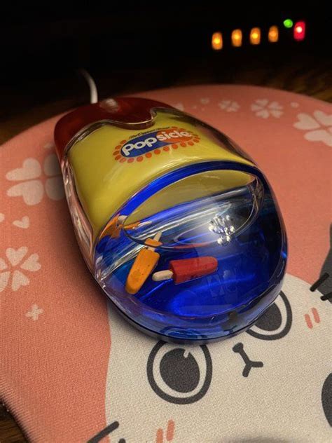 A Close Up Of A Toy Mouse On A Table