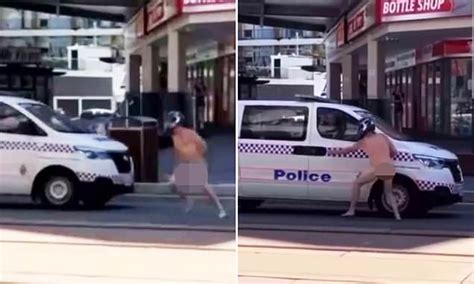 Bizarre Moment A Naked Man Wearing Runs In Front Of Police Wagon Before