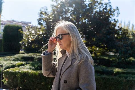 Coolest White Hair Woman With Sunglasses On A Sunny Day In The Park