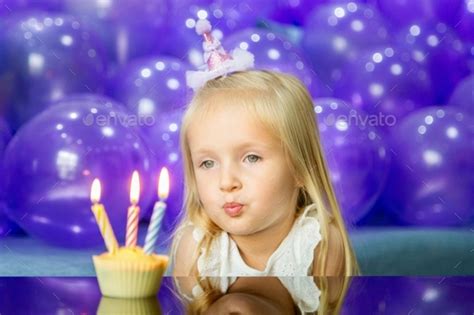 Cute Little Caucasian Girl With Blonde Hair Celebrating Three Years Old Birthday At Home Stock