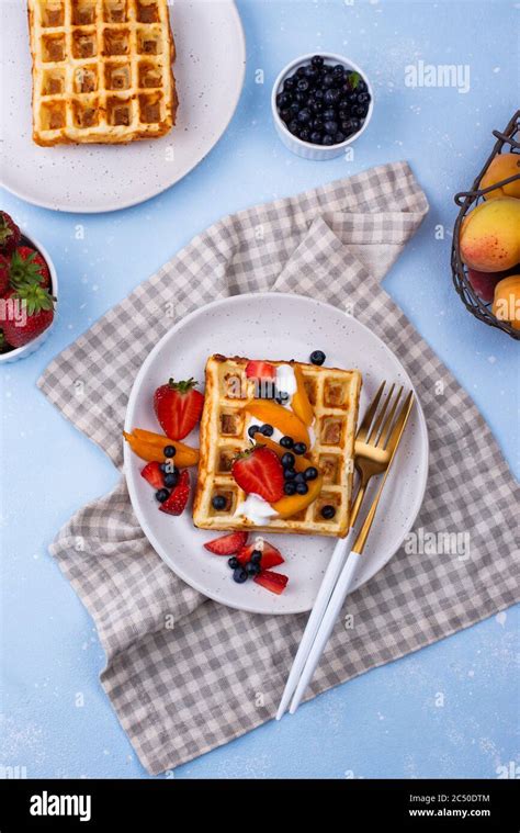 Waffles with berries and fruit Stock Photo - Alamy