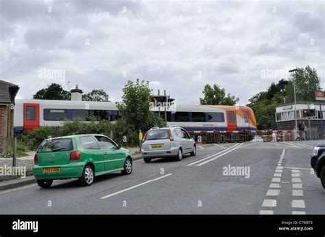 A South West Trains Class 444 Electric Multiple Unit Leaves Brockenhurst Across The Level