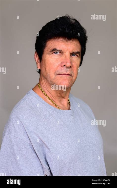 Portrait Of Mature Handsome Man Looking At Camera Stock Photo Alamy