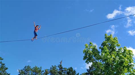 A Tightrope Walker Walks on a Tightrope Editorial Stock Photo - Image of mast, sunlight: 285996448