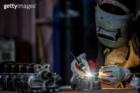 Welder In Face Mask Welds With Argon Arc Stainless Steel Welding