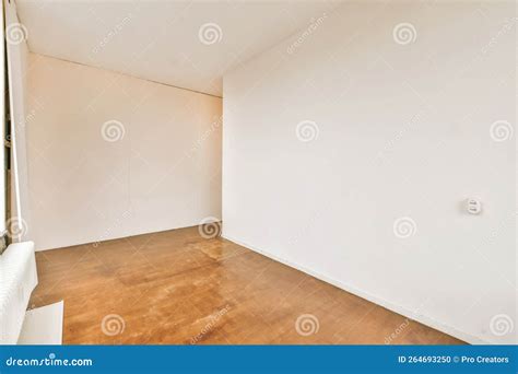 An Empty Room with White Walls and a Wooden Floor Stock Photo - Image ...