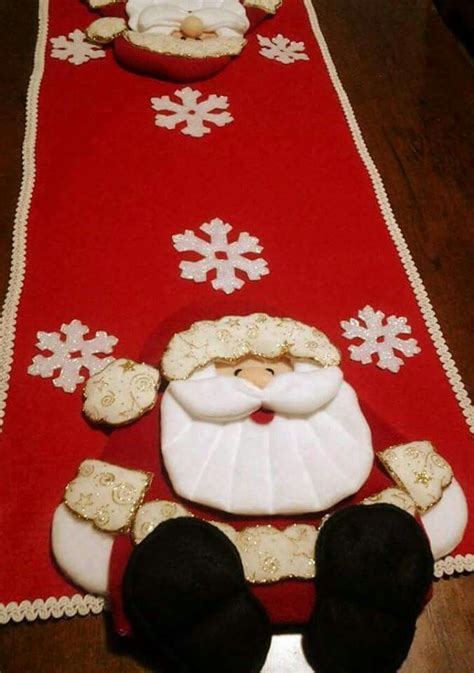 A Santa Clause Table Runner With Snowflakes And Cookies On The Floor