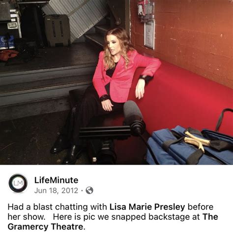 A Woman Sitting On Top Of A Bench Next To Luggage