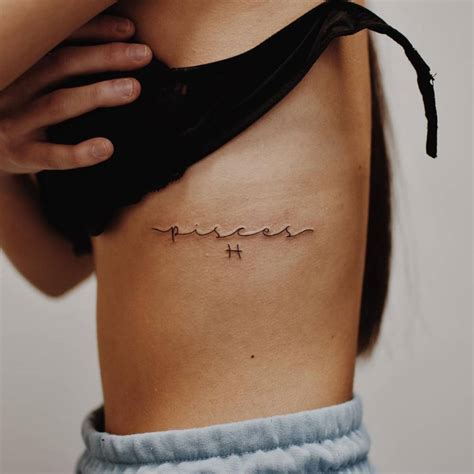 Pisces Lettering Tattoo On The Rib