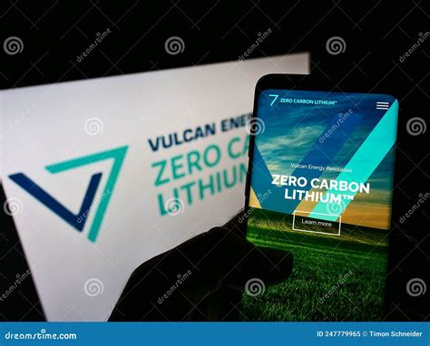 Person Holding Mobile Phone With Website Of Australian Company Vulcan