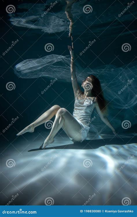 Beautiful Girl in White Dress Underwater. Water Magic. Underwater Photography. Art Stock Photo ...