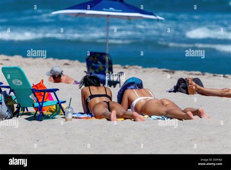 Girls On Fort Lauderdale Beach Texting During Spring Break 2021 Stock