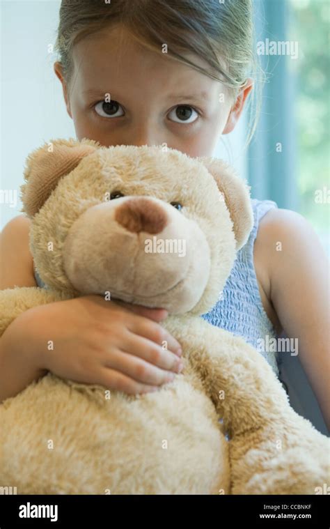 Girl Hugging Teddy Bear – Telegraph