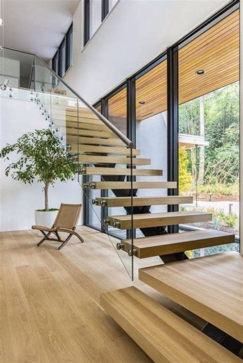 Modern Straight Floating Staircase With Glass Railing And Wood Treads