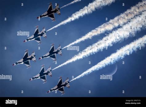 The US Air Force Thunder Birds Pass In Front Of The Moon While