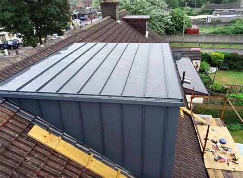 Metal Standing Seam Pitched Roof Extension With Roof Lights And Dormer