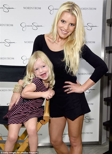 Jessica Simpson Is Stunning In Floppy Black Hat And Playsuit As She