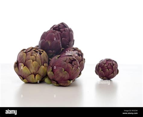 Raw Artichokes Mediterranean Vegetable Uncooked On White Stock Photo