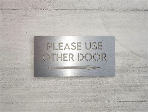 Please use other door sign with arrow. Front door signs. Use other door