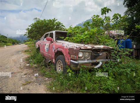 Old Abandoned Car By The Side Of The Road Rural Sabah Borneo Malaysia