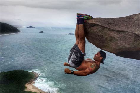 This Man Hanging Off The Edge Of A Cliff Is Not What It Seems Daily Star