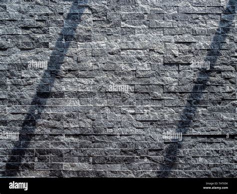 Modern grey brick wall texture background. Shadow shade light on stone ...