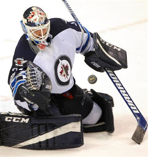 Winnipeg Jets Goalie Michael Hutchison Blocks A St Louis Blues Shot