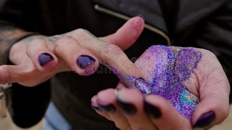 Close Up Of Hands Covered With Bright Sparkles Woman Shows Shiny Hands Fingering With Fingers