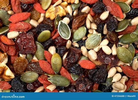 Mix Nuts Seeds And Dry Fruits, On A Wooden Table Stock Photo - Image ...