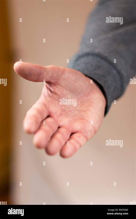 Hand Reaching Out For A Handshake Stock Photo Alamy