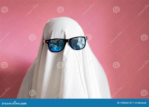 Cute Sheet Ghost Costume With Sunglasses On A Pink Background Halloween Party Carnival Concept