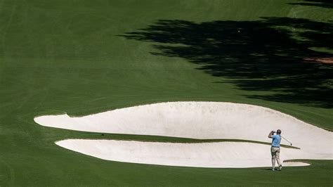 Masters Champion Nick Faldo Of England Plays A Stroke From The No