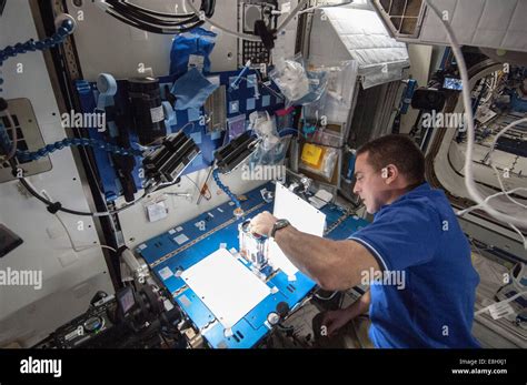 Nasa Astronaut Chris Cassidy Expedition 36 Flight Engineer Works On The Capillary Flow