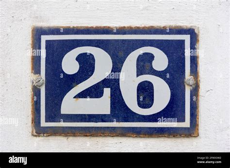Number 26 in white on a blue metal plate Stock Photo - Alamy
