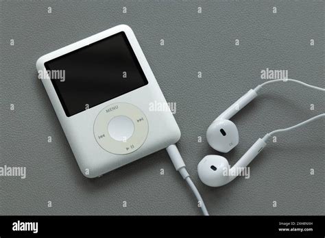 An Apple iPod Nano 3rd Generation mp3 player, silver in colour, with a ...