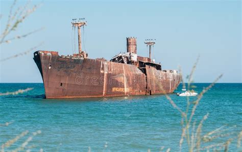 A Shipwreck. an Old Wreck Abandoned at Sea Stock Image - Image of boat, beach: 192776437