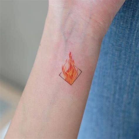 Picture Of Tiny flame tattoo on the wrist