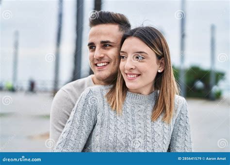 Man And Woman Couple Smiling Confident Hugging Each Other At Street